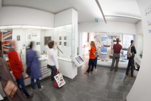 Several people looking at exhibition displays