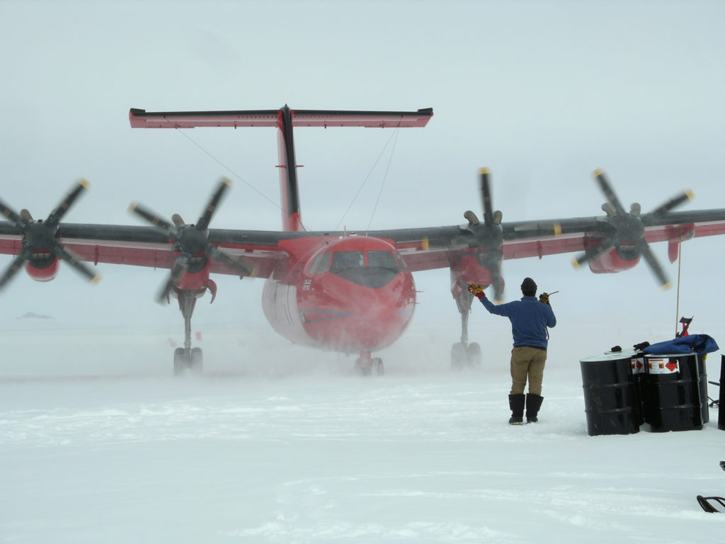 Plane being guided into land